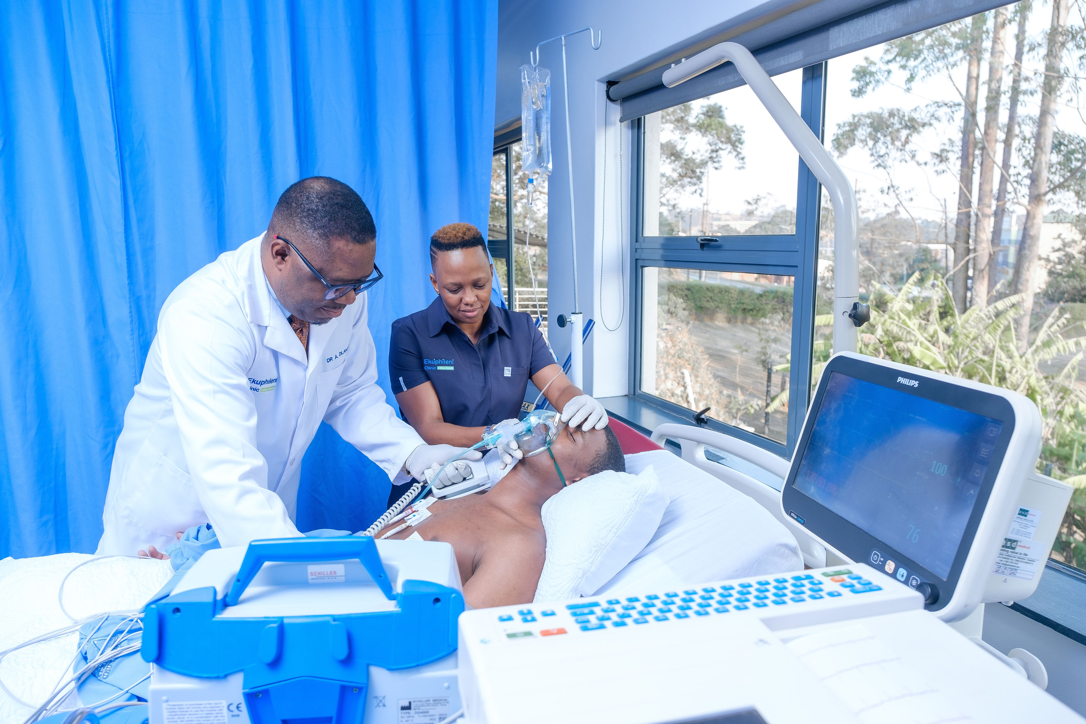 Ekuphileni Clinic team helping a patient